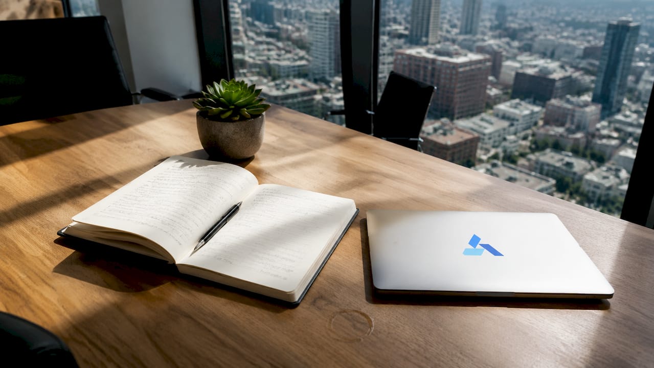 Business analytics workspace with Blue Prysm branded laptop