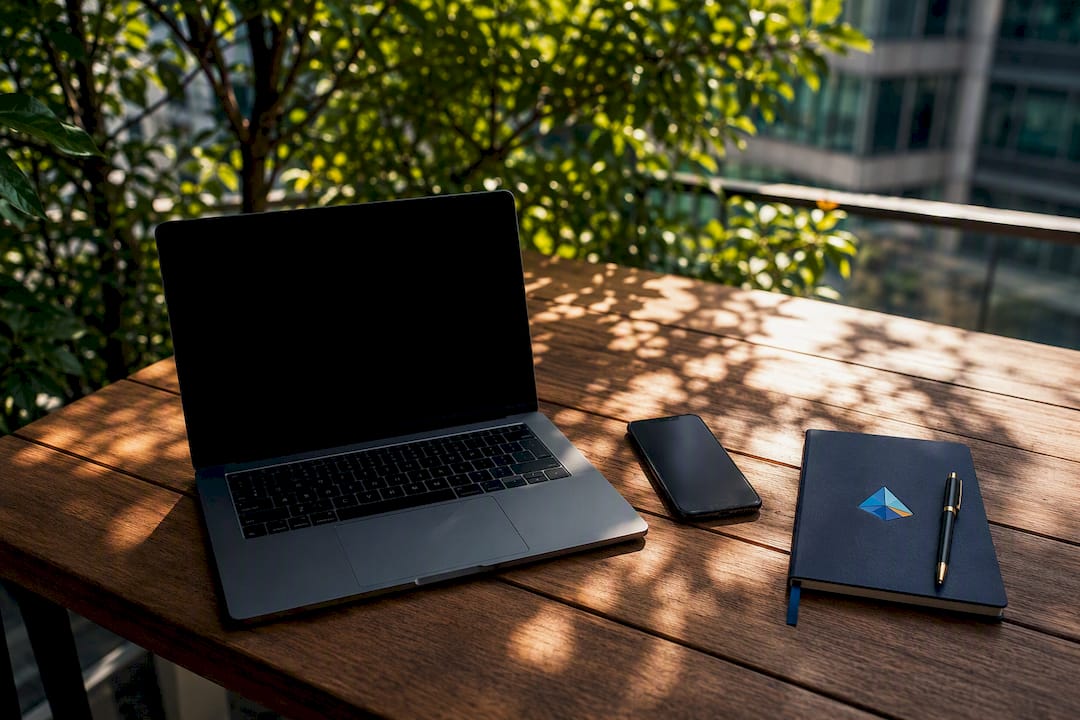 Modern workspace with devices and Blue Prysm logo