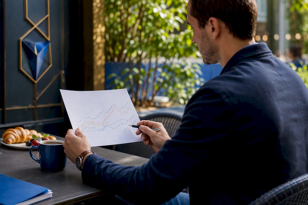 Hands analyzing market trend graph